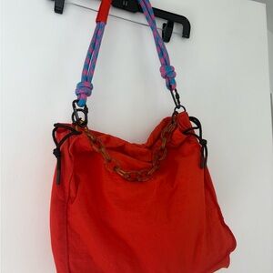 Stylish Red Women's Bag with Multicolor Strap